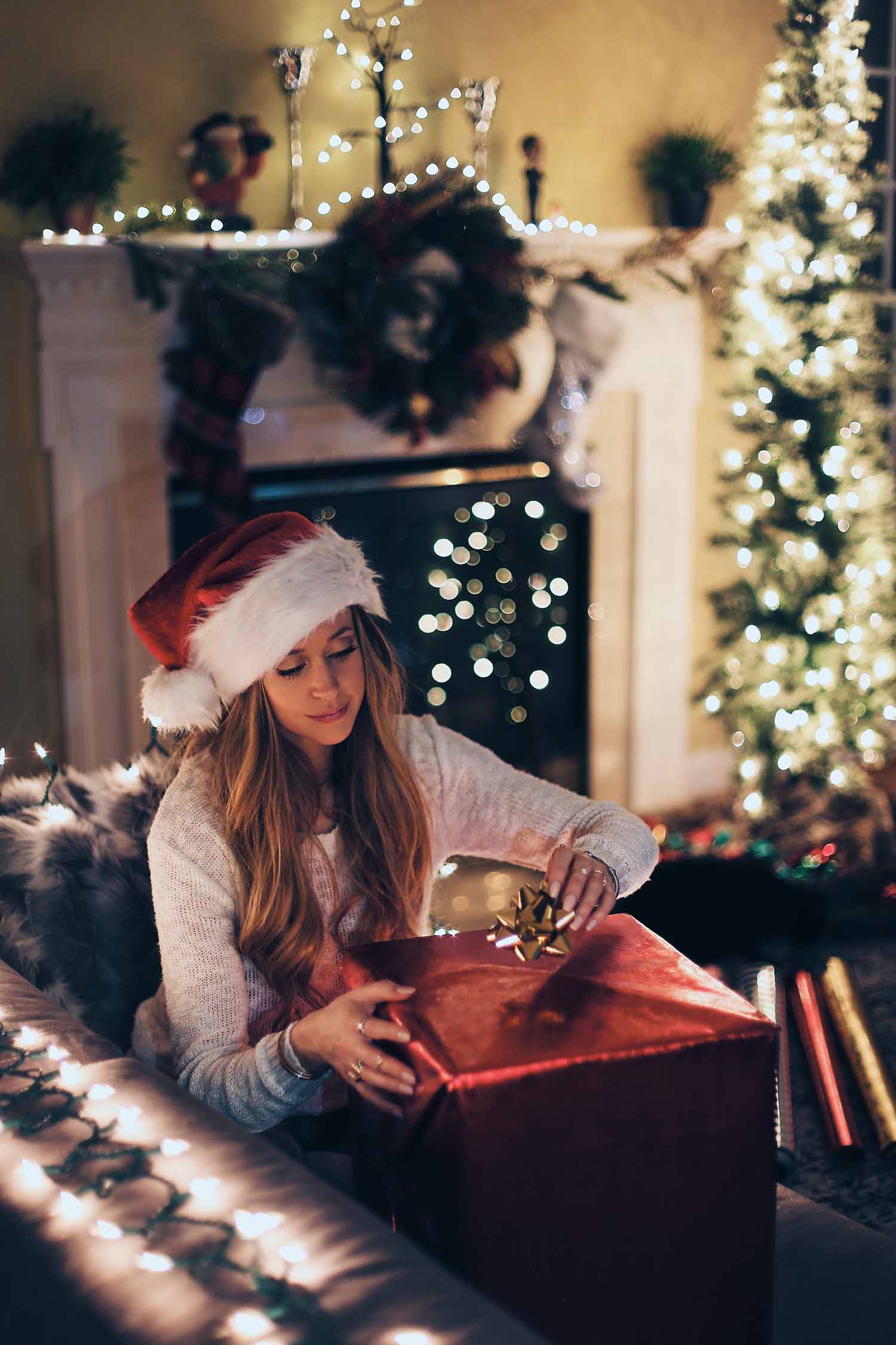 a person opening a present